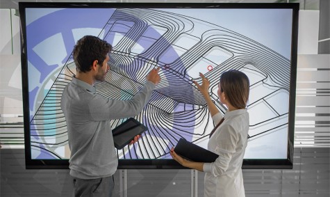 Fotomontage eines Designentwurfs und des Feldlinienbilds einer elektrischen Maschine. Bild: simonkr / iStock