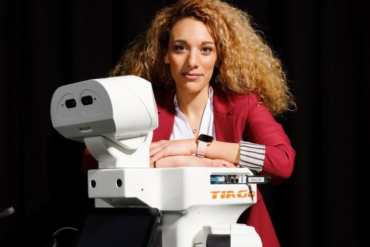 Dr. Georgia Chalvatzak with the robot TIA Go